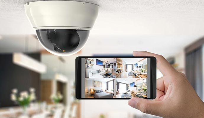 inspecting home with security camera